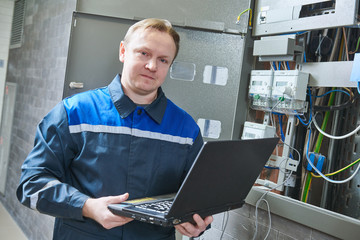 Electricity power control and metering. Worker collects data