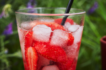 Cold strawberry drink with strawberry slices and mint