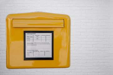 Yellow letterbox in germany isolated on white