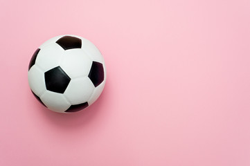 soccer ball or football on pink background