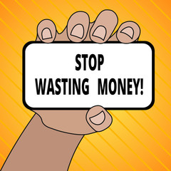Text sign showing Stop Wasting Money. Business photo text advicing demonstrating or group to start saving and use it wisely Closeup of Smartphone Device Held in Hand with Blank Screen and Text Space