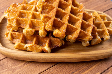 waffle on a plate on the wooden table