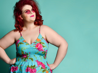 Pretty plus-size fat woman with enigmatic mysterious face looks at us like she suspects us of prank...