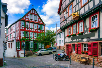 Fototapeta na wymiar Facade of old historic houses from public area in Gelnhausen