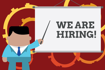 Conceptual hand writing showing We Are Hiring. Concept meaning recently you employ someone or pay someone to do particular job Businessman in front projector screen pointing project idea
