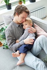 lifestyle, family and people concept - Happy young father with his one year old son playing at home