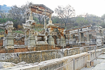 Fototapeta na wymiar Fountain of Trajan, the Nympheum, on Curetes Street which was dedicated to the emperor Trojan along the Curetes Road in the ancient city ruins of Ephesus, Turkey near Selcuk.