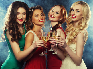 lifestyle, party and people concept - Group of partying girls wearing dress, with sparkling wine