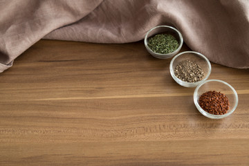various spices with wooden handmade spoon on the table for food photography concept.