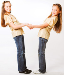 Two little  girls hugging each other