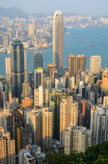 Fototapeta premium Tall skyscraper buildings in Hong Kong's busy Central District at sunset