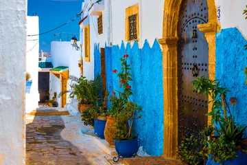 Zelfklevend Fotobehang Blue and White Street in the Kasbah des Oudaias in Rabat Morocco © Natallia