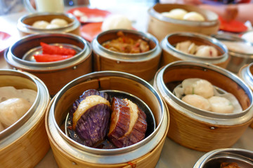 blur varieties dim sum baskets Chinese foods on table