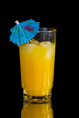 Vodka and Orange juice mixed drink with a cocktail umbrella.