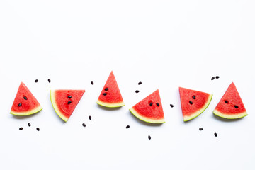 Slices of watermelon with seeds isolated on white background.