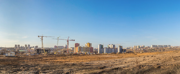 Panorama of the construction site of a residential microdistrict