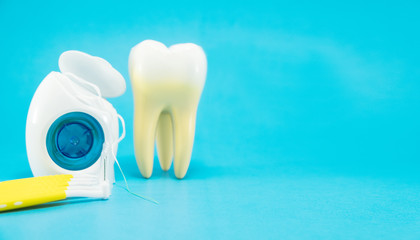 dental tools and tooth model on the blue background