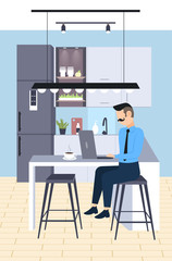 businessman sitting at workplace desk business man freelancer using laptop working process concept modern kitchen interior flat full length vertical