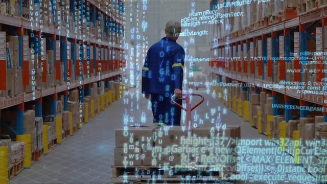 Man dragging a fork lift inside a warehouse