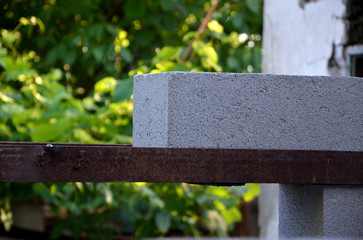  Laying cinder block on the metal corners in the place of the doorway.