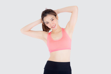 Beautiful portrait young asian woman standing stretch muscle arm isolated on white background, girl wear sport clothes exercise and yoga for health, wellness concept.
