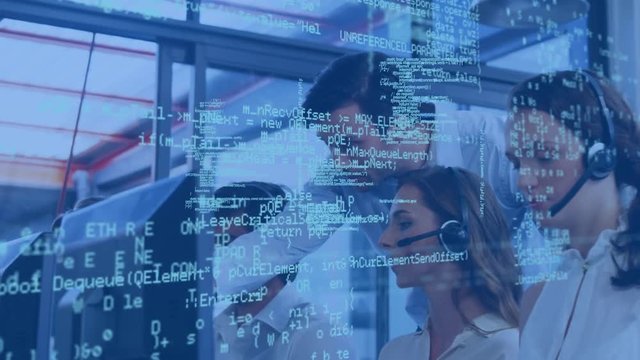 Supervisor assisting a colleague in an office