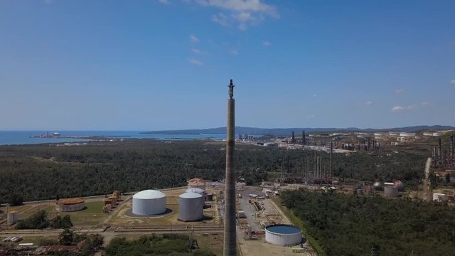 Shut down refinery and flew around the refractor with the ocean behind all this rusting metal.