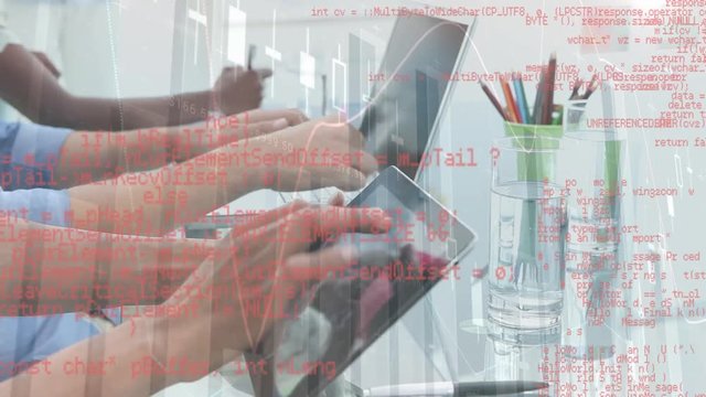 People using a pen and paper, laptop, and tablet