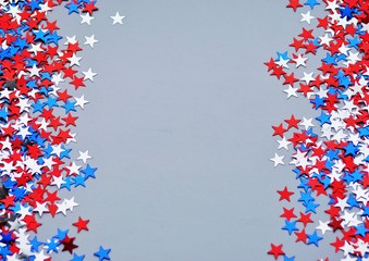 american independence day, celebration, patriotism and holidays concept - red and blue paper stars...