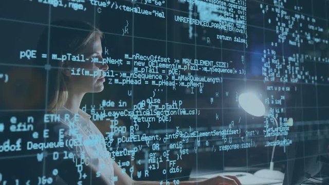 Woman using a computer and a man with a tablet in the office