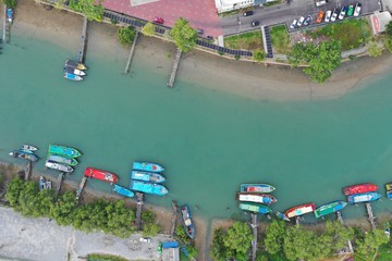 Fototapeta na wymiar Traditional fishing boats in harbour in Southeast Asia. Aerial photo 