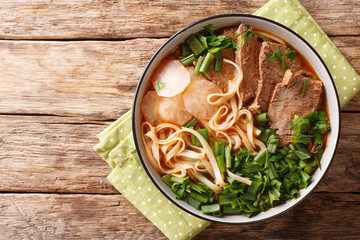 Easy Recipe for Lanzhou Beef Noodle Soup closeup in a bowl. Horizontal top view