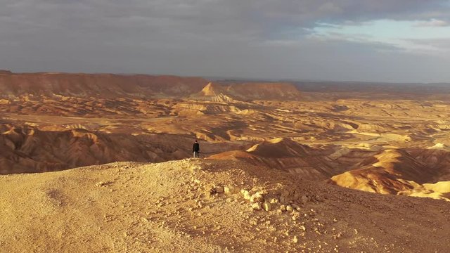 Aerial Spin: Man Walking in a Desert in Negev Desert, Israel
