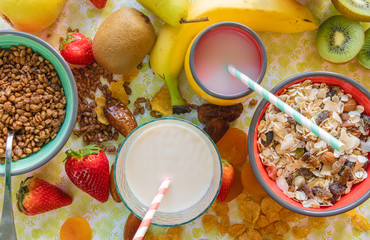 Bowls with breakfast cereals and juices