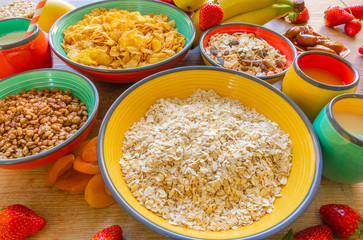 Tasty homemade breakfast of cereals, milk, dried plums