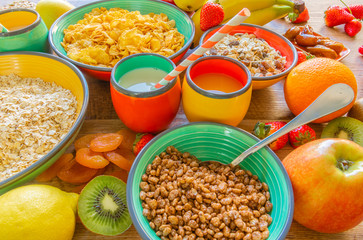 Assorted breakfast cereals, fruits and juices