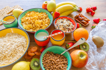 Fototapeta na wymiar Top view of fruits and breakfast cereals