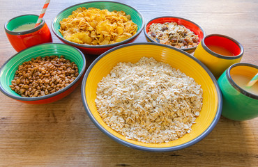Different types of cereals served in ceramic bowls