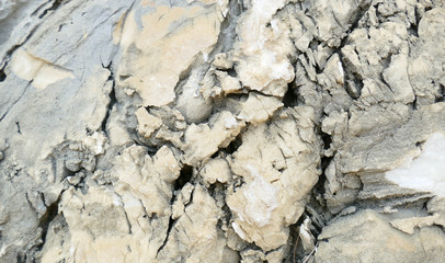 Texture of natural stone. Modern background. Image. Design for poster. Abstract backdrop. Black, grey, biege, sepia. Hole on the surface. Patterns and textures of rocks in nature. Closeup detail stone