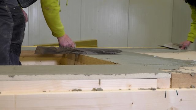 Plaster applying grout by trowel