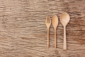 top view wooden spoon ,fork on wood floor with copy space