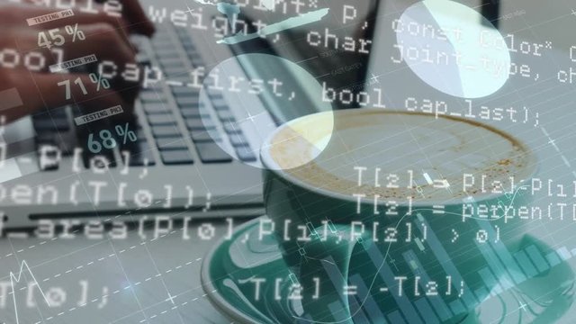 Person typing on a laptop with a cup of coffee