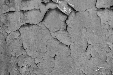 Old cracked paint on the concrete wall. Peeling paint on wall texture. Pattern of rustic blue grunge material