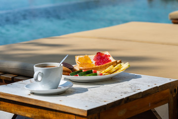 Delicious breakfast on the swimming pool in luxury resort
