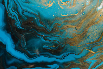 Acrylic Fluid Art. Blue aquamarine waves and gold inclusion. Abstract marble background or texture