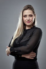 Fototapeta premium Pretty businesswoman on gray