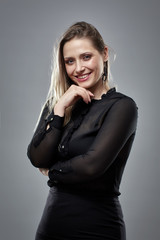 Fototapeta premium Pretty businesswoman on gray