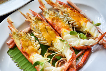 Grilled river prawn with head oil butter, Fresh water giant prawn roasted, Famous mouthwatering dishes for traditionally thai food.