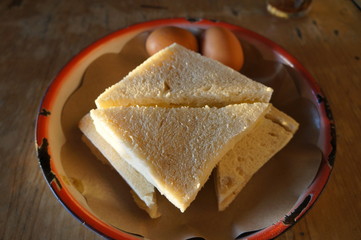 Asian sandwich with banana and eggs on a plate