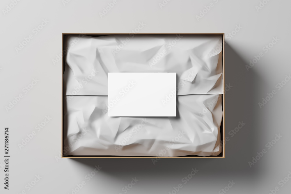Fototapete open gift box with white wrapping paper and business card on a light background. business gift. mock